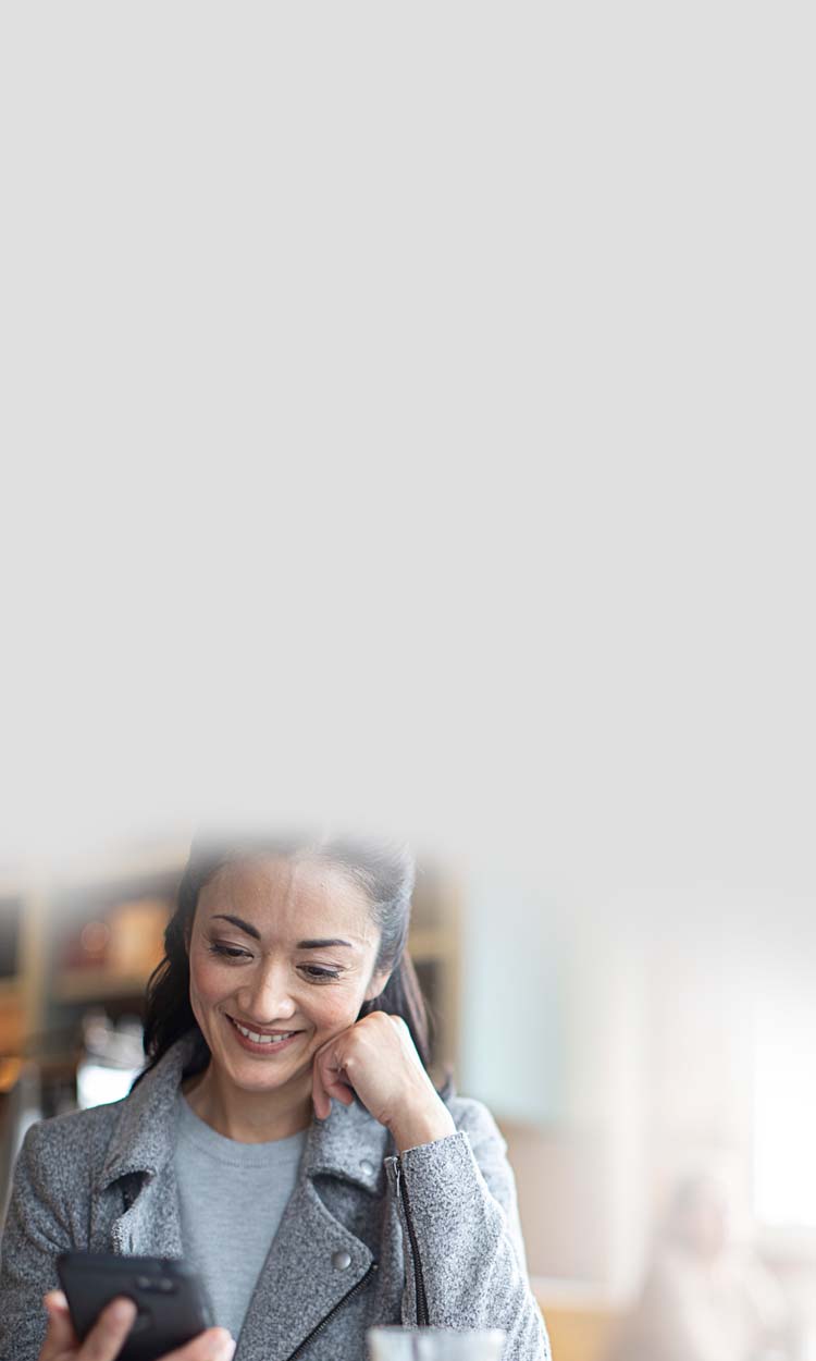 Woman using the Starkey Thrive Hearing Control app