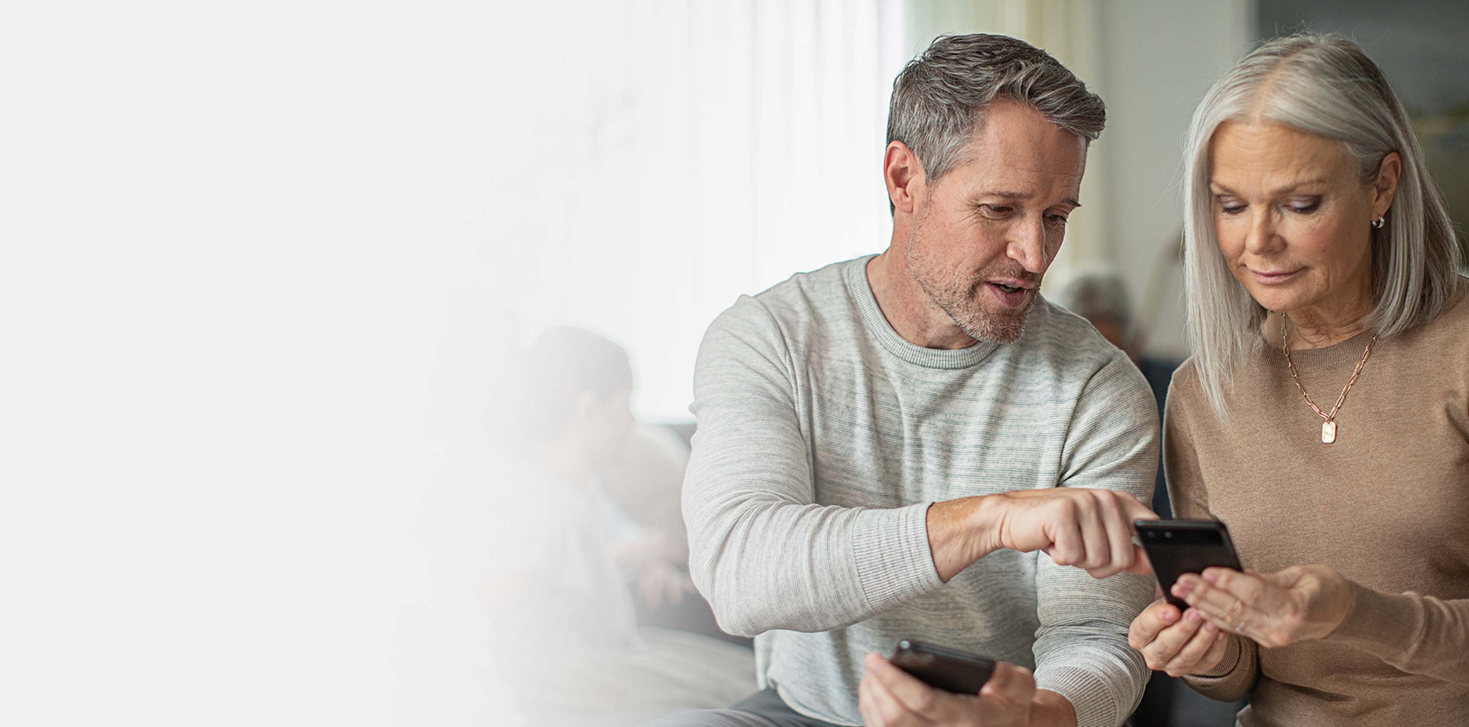 Caregivers using the Starkey Thrive Care app