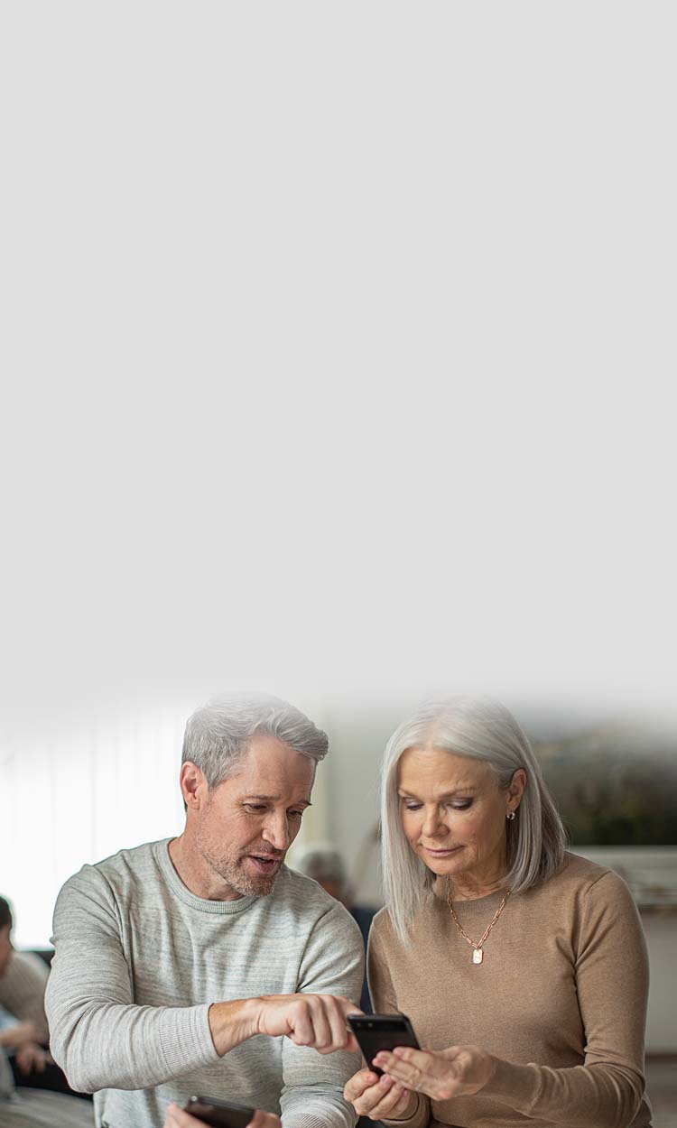 Caregivers using the Starkey Thrive Care app